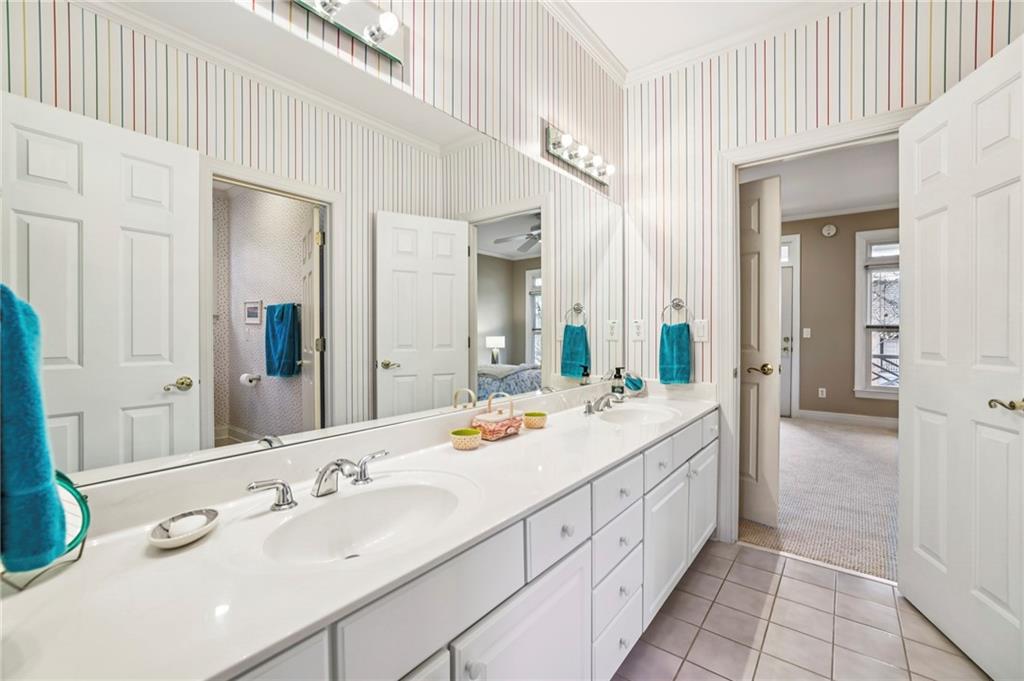 3519 High Grove Way Atlanta, GA 30319 - Photo 26 of 38 a spacious bathroom with a double vanity sink mirror and double