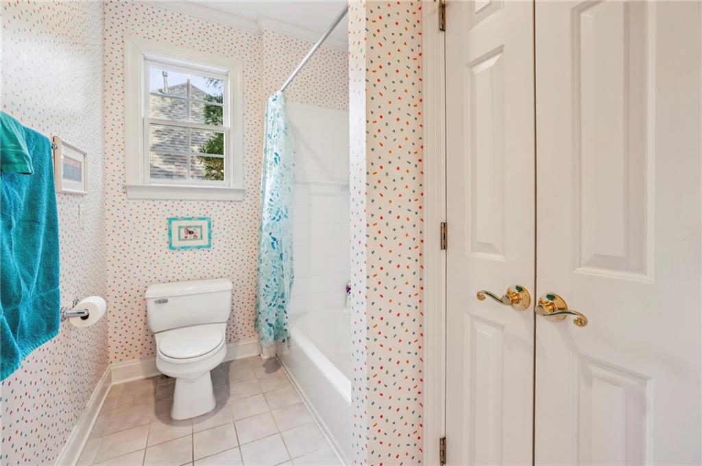 3519 High Grove Way Atlanta, GA 30319 - Photo 27 of 38 a white toilet sitting next to a bathroom sink