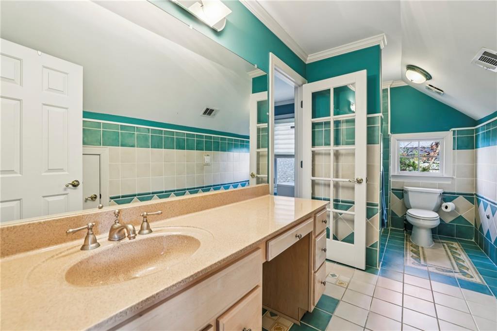 3519 High Grove Way Atlanta, GA 30319 - Photo 32 of 38 a bathroom with a sink and a mirror