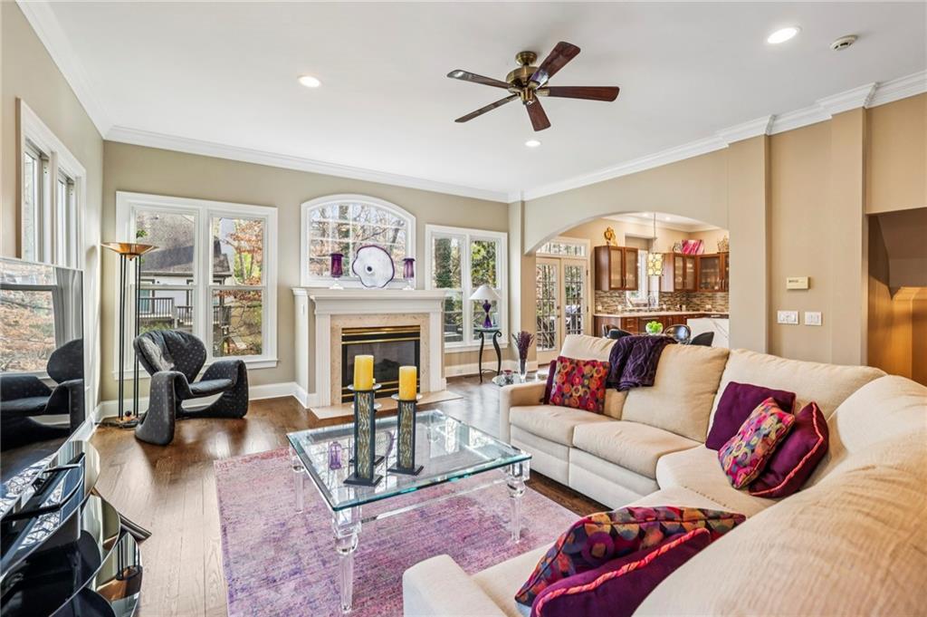 3519 High Grove Way Atlanta, GA 30319 - Photo 7 of 38 a living room with furniture a large window and a fireplace