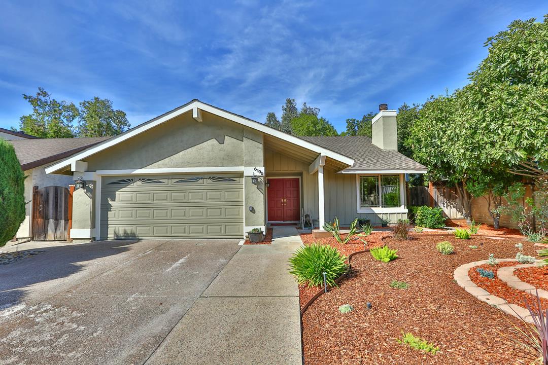 6195 Flowering Plum Road San Jose, CA 95120 - Photo 1 of 22 a front view of a house with a yard and garage