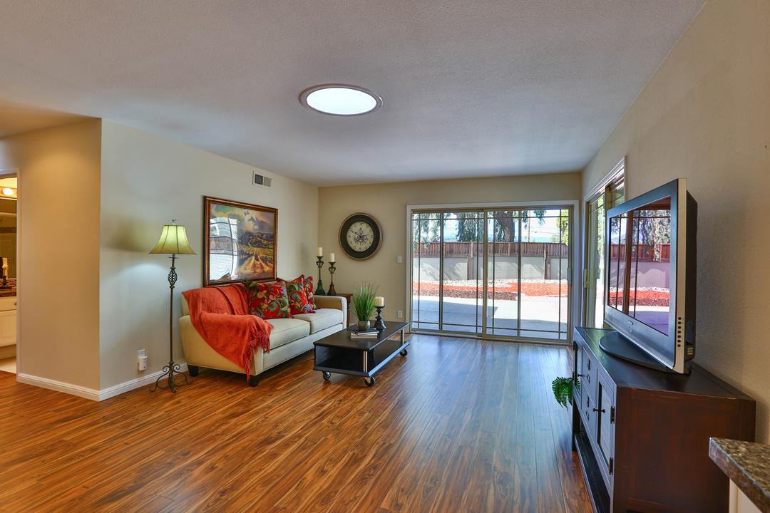 6195 Flowering Plum Road San Jose, CA 95120 - Photo 11 of 22 a living room with furniture and a flat screen tv