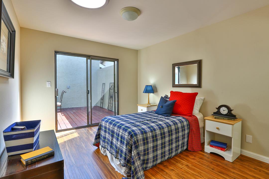 6195 Flowering Plum Road San Jose, CA 95120 - Photo 12 of 22 a bedroom with a bed and wooden floor