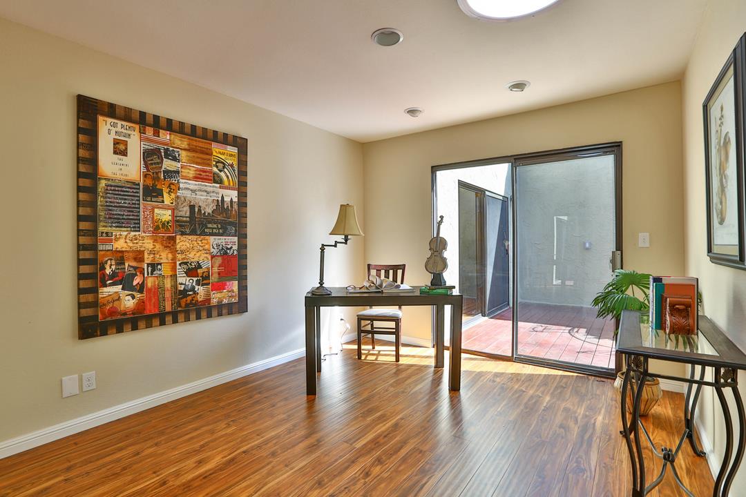 6195 Flowering Plum Road San Jose, CA 95120 - Photo 13 of 22 a view of a work space with wooden floor and furniture