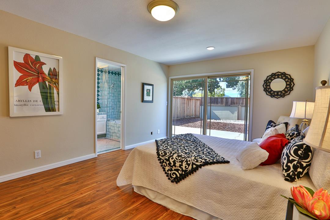 6195 Flowering Plum Road San Jose, CA 95120 - Photo 16 of 22 a bedroom with a bed and a window