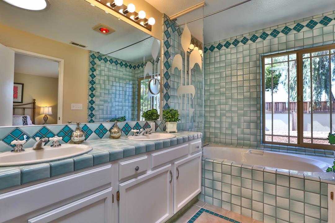 6195 Flowering Plum Road San Jose, CA 95120 - Photo 17 of 22 a bathroom with a sink and a mirror