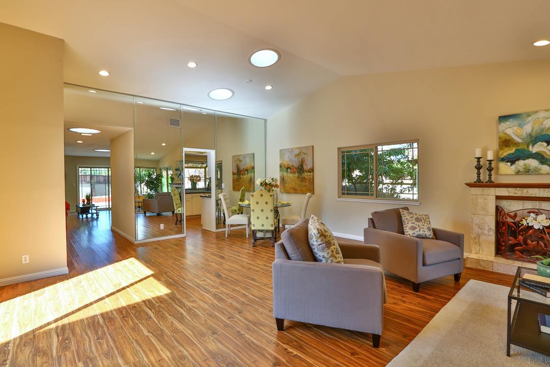 6195 Flowering Plum Road San Jose, CA 95120 - Photo 2 of 22 a living room with furniture and a fireplace