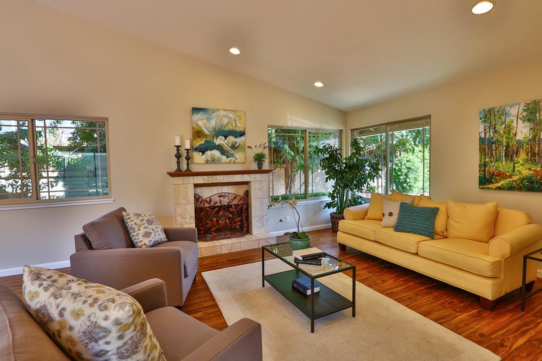 6195 Flowering Plum Road San Jose, CA 95120 - Photo 3 of 22 a living room with furniture and a fireplace