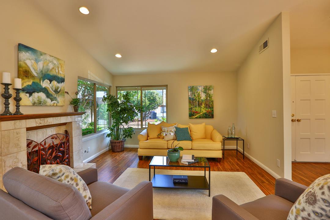 6195 Flowering Plum Road San Jose, CA 95120 - Photo 4 of 22 a living room with furniture and a fireplace