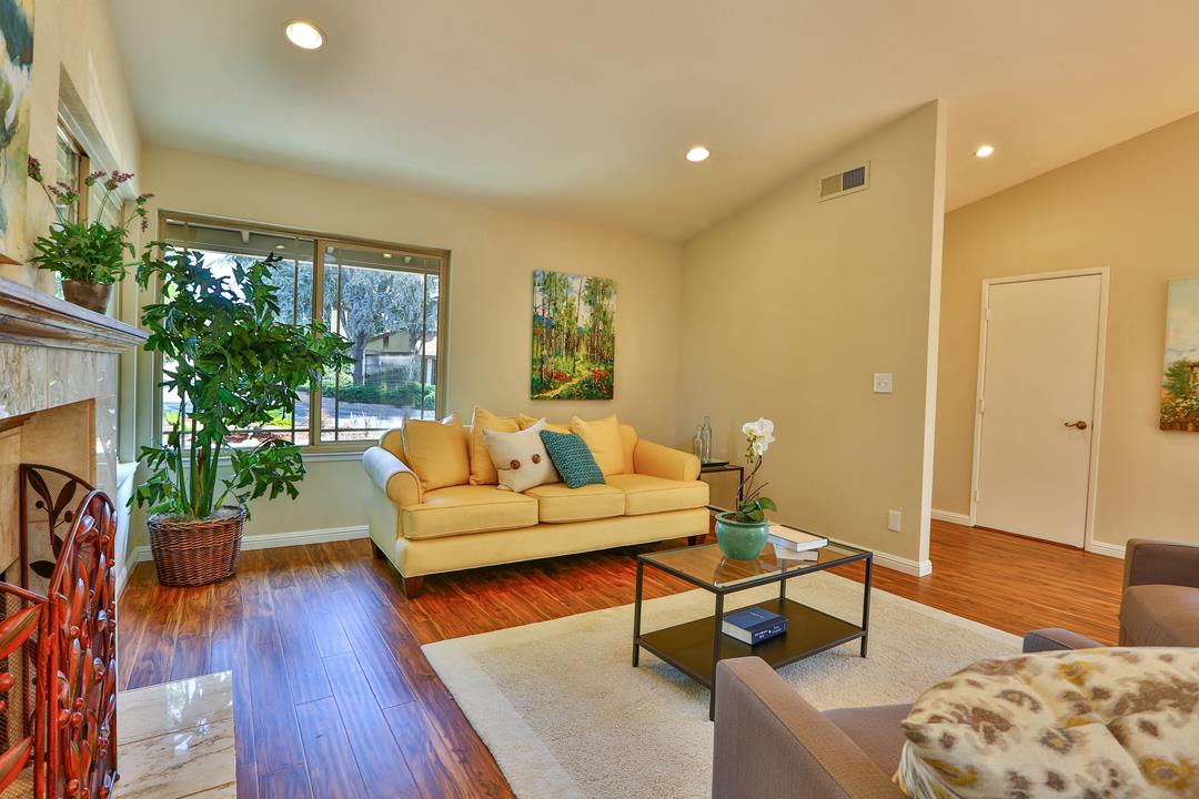 6195 Flowering Plum Road San Jose, CA 95120 - Photo 5 of 22 a living room with furniture and a fireplace