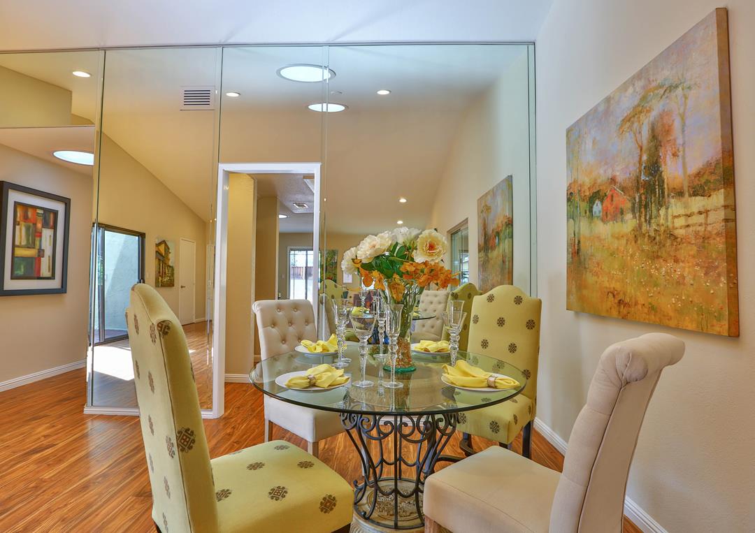 6195 Flowering Plum Road San Jose, CA 95120 - Photo 7 of 22 a view of a dining room with furniture and wooden floor