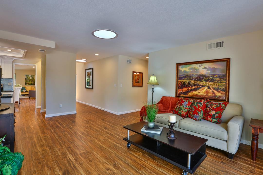 6195 Flowering Plum Road San Jose, CA 95120 - Photo 10 of 22 a living room with furniture and wooden floor