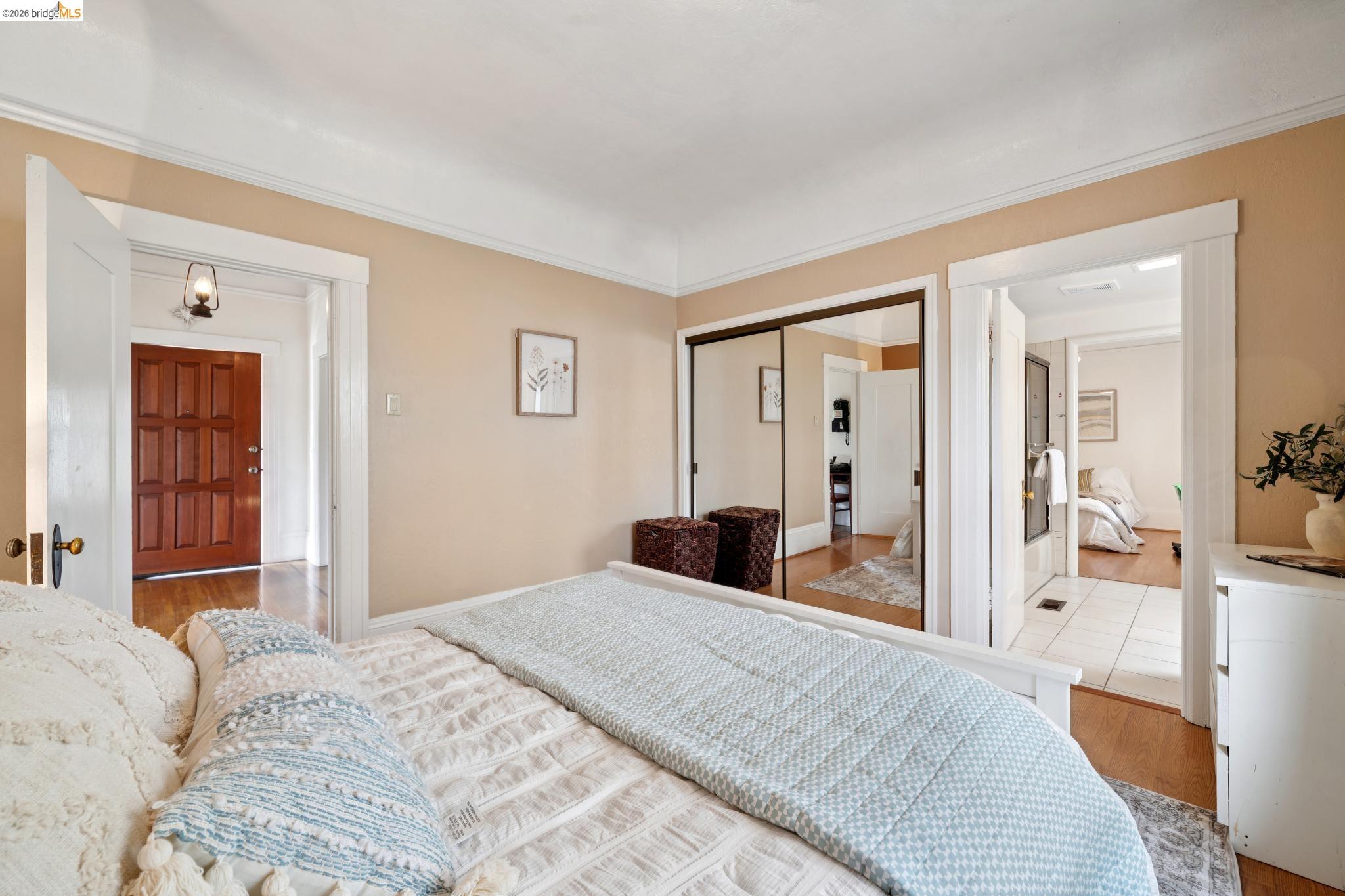 892 Laurel Street Alameda, CA 94501 - Photo 26 of 45 Bedroom featuring light beige walls, white trim, wood-finish flooring, mirrored closet doors, and recessed lighting