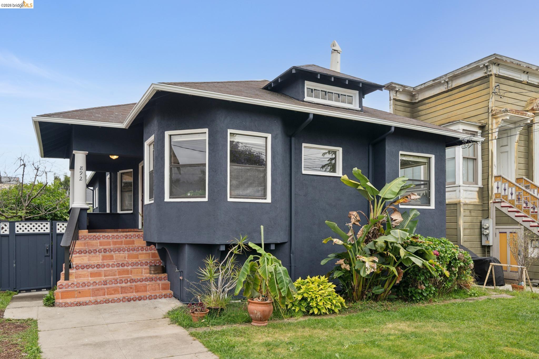892 Laurel Street Alameda, CA 94501 - Photo 3 of 45 Gray stucco exterior featuring white trim windows