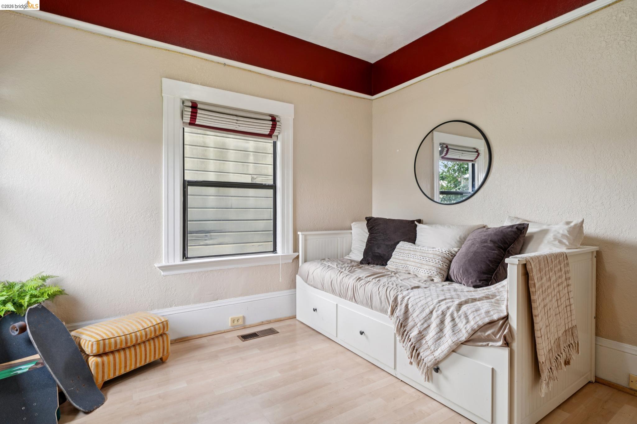 892 Laurel Street Alameda, CA 94501 - Photo 33 of 45 Room featuring light-toned flooring, white baseboards, and a window with white trim