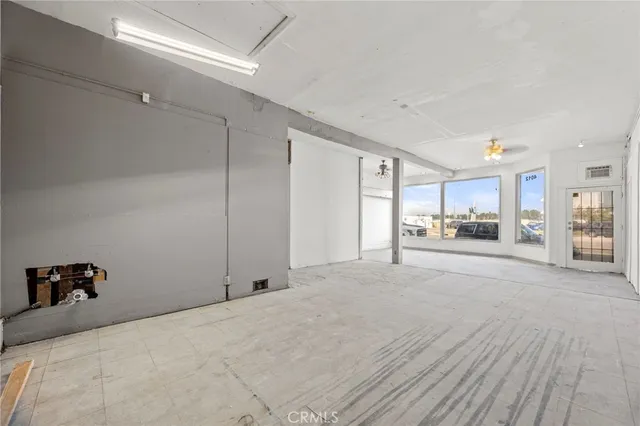 a view of a livingroom with furniture and a rug