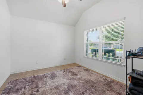 a view of empty room with windows