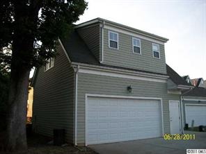 557 Jetton Street Davidson, NC 28036 - Photo 13 of 16 a front view of a house with garage