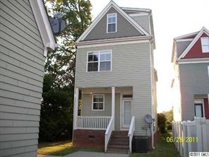 557 Jetton Street Davidson, NC 28036 - Photo 2 of 16 a front view of a house with garden