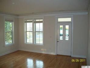 557 Jetton Street Davidson, NC 28036 - Photo 3 of 16 an empty room with windows