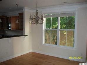 557 Jetton Street Davidson, NC 28036 - Photo 5 of 16 a view of a room that has a large window in it
