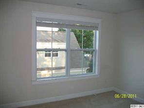 557 Jetton Street Davidson, NC 28036 - Photo 7 of 16 an empty room with a window