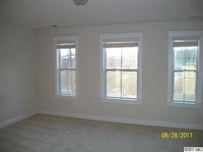 557 Jetton Street Davidson, NC 28036 - Photo 9 of 16 an empty room with windows