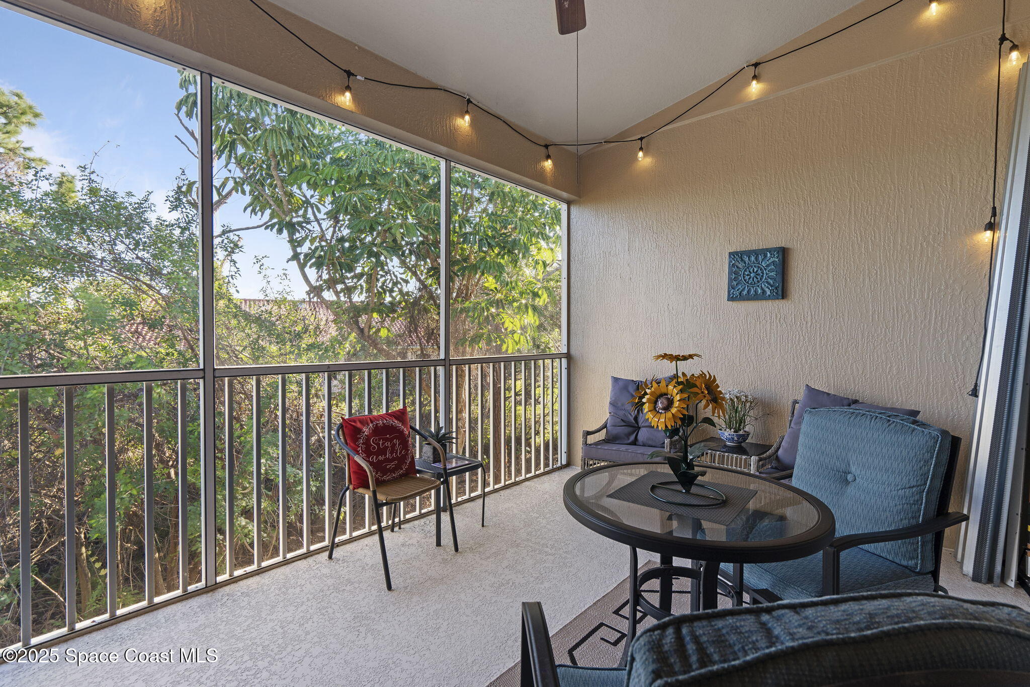 401 Trotter Lane, Unit 202 Melbourne, FL 32940 - Photo 15 of 38 a view of a livingroom with furniture window and outside view
