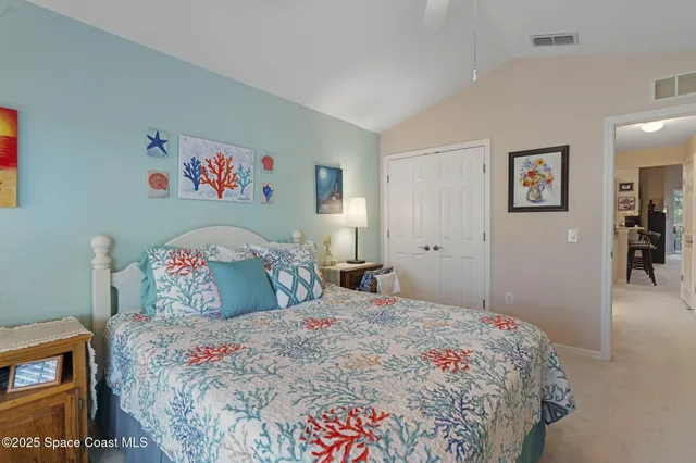 a bedroom with a bed and a view of bathroom