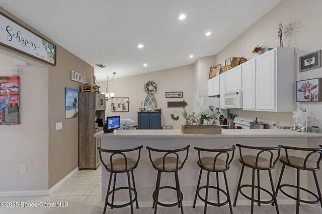 a kitchen with a table and chairs in it