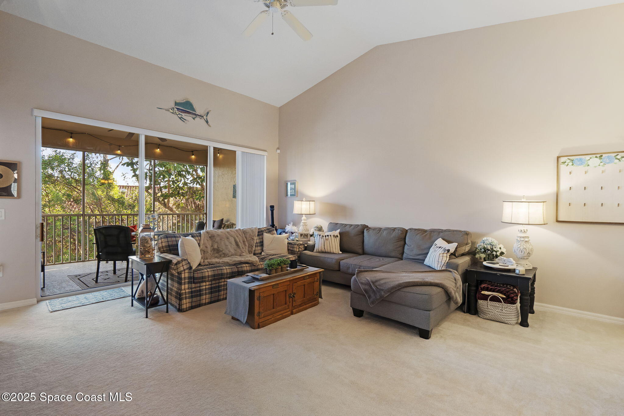 401 Trotter Lane, Unit 202 Melbourne, FL 32940 - Photo 3 of 38 a living room with furniture and a large window
