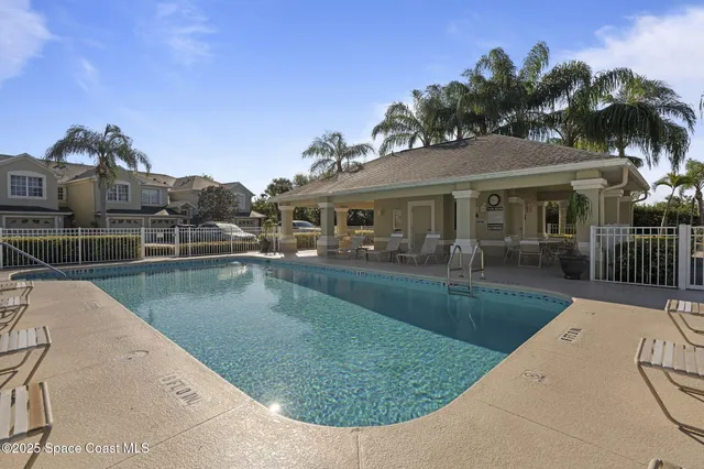 a view of a house with swimming pool