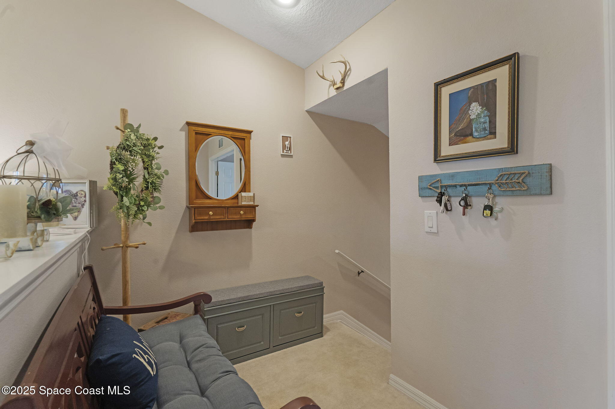 401 Trotter Lane, Unit 202 Melbourne, FL 32940 - Photo 7 of 38 a bathroom with a toilet sink and mirror