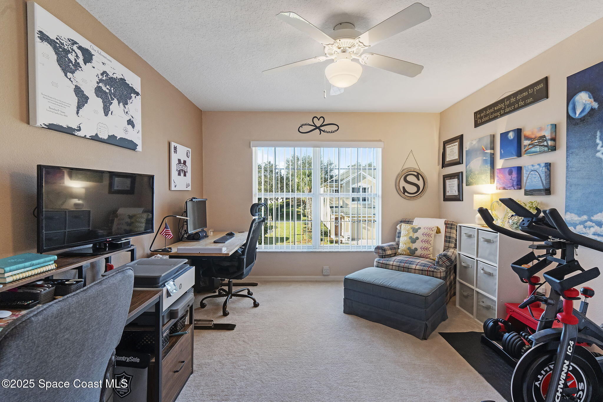 401 Trotter Lane, Unit 202 Melbourne, FL 32940 - Photo 8 of 38 a living room with furniture and a flat screen tv
