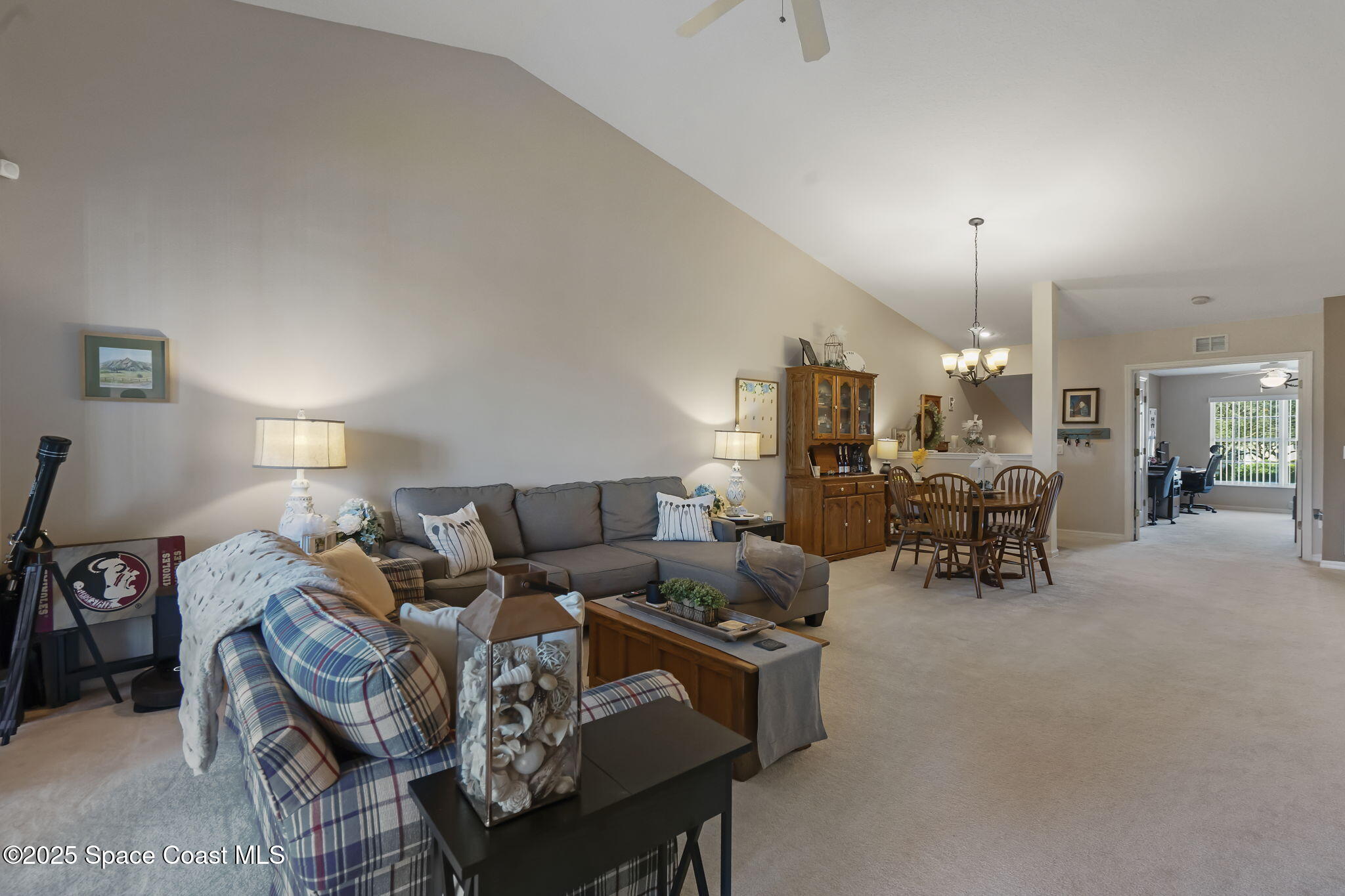 401 Trotter Lane, Unit 202 Melbourne, FL 32940 - Photo 10 of 38 a living room with furniture and wooden floor