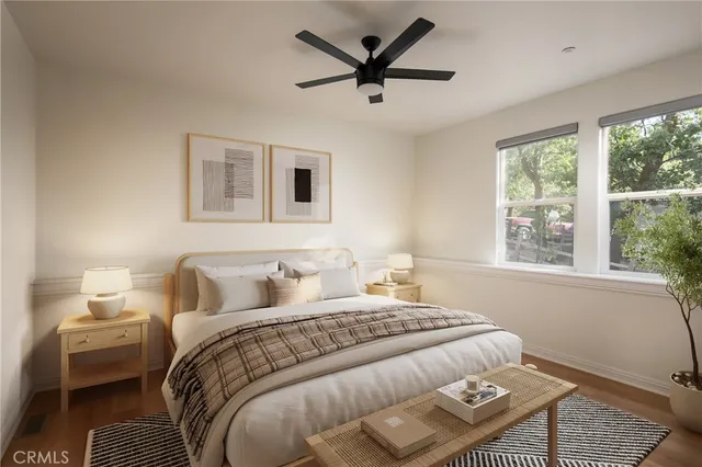 a bedroom with a large bed and a window