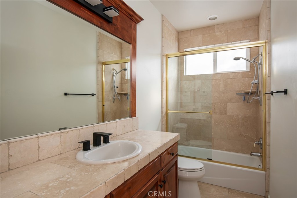 1477 Sequoia Drive Lake Arrowhead, CA 92352 - Photo 16 of 25 a bathroom with a sink a toilet and shower