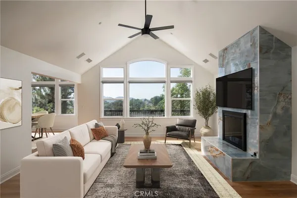 a living room with fireplace furniture and a flat screen tv