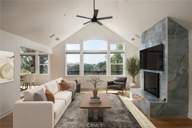 a living room with fireplace furniture and a flat screen tv