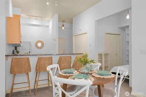 a view of a dining room with furniture and wooden floor