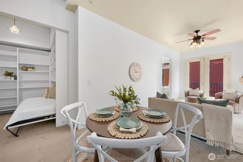 a dining room with furniture and window