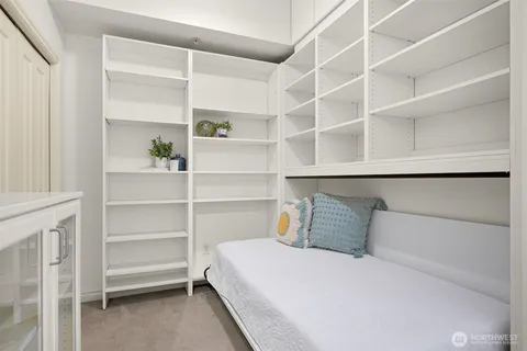 a bedroom with a bed and closet