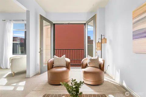 a living room with furniture and a window