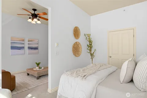 a bedroom with a bed and a chandelier