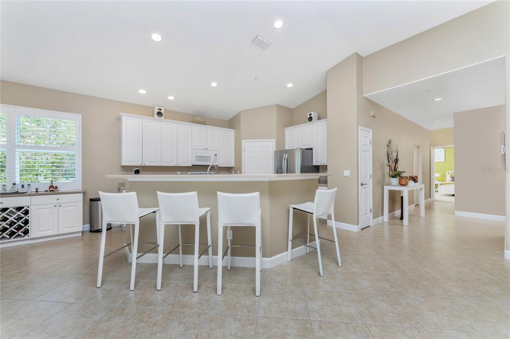 3316 Sunset Key Circle, Unit D Punta Gorda, FL 33955 - Photo 14 of 68 a large kitchen with table and chairs