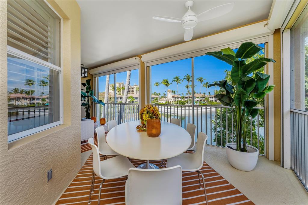 3316 Sunset Key Circle, Unit D Punta Gorda, FL 33955 - Photo 15 of 68 a dining room with furniture and a potted plant