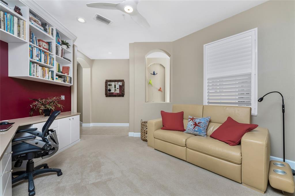 3316 Sunset Key Circle, Unit D Punta Gorda, FL 33955 - Photo 21 of 68 a living room with furniture and a window