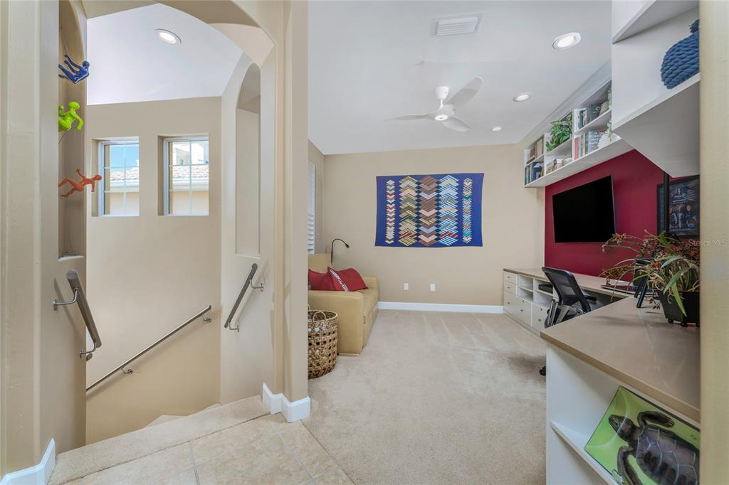 3316 Sunset Key Circle, Unit D Punta Gorda, FL 33955 - Photo 23 of 68 a living room with furniture and a flat screen tv