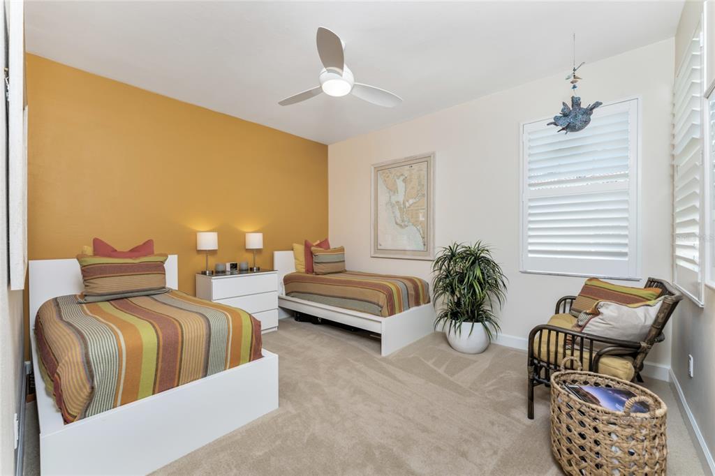 3316 Sunset Key Circle, Unit D Punta Gorda, FL 33955 - Photo 27 of 68 a bedroom with furniture and a large window