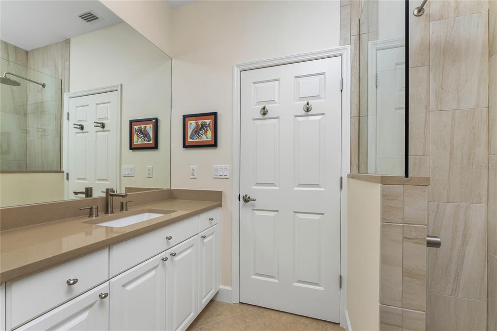 3316 Sunset Key Circle, Unit D Punta Gorda, FL 33955 - Photo 29 of 68 a bathroom with a sink and a mirror